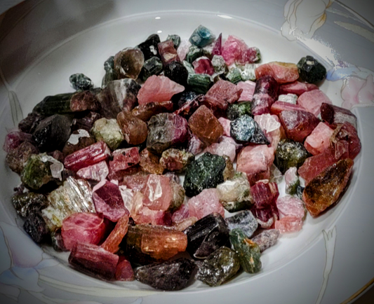 A plate full of tourmaline jewels that look like candy in their bright pinks and greens